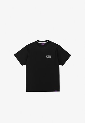 Black cotton t-shirt with short sleeves, round neck, and a white graphic design on the left chest area. Purple brand label at the bottom.
