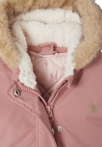 Pink jacket with a fur-lined hood, soft white inner lining, and floral pattern. Features a heart-shaped accent and zip closure.