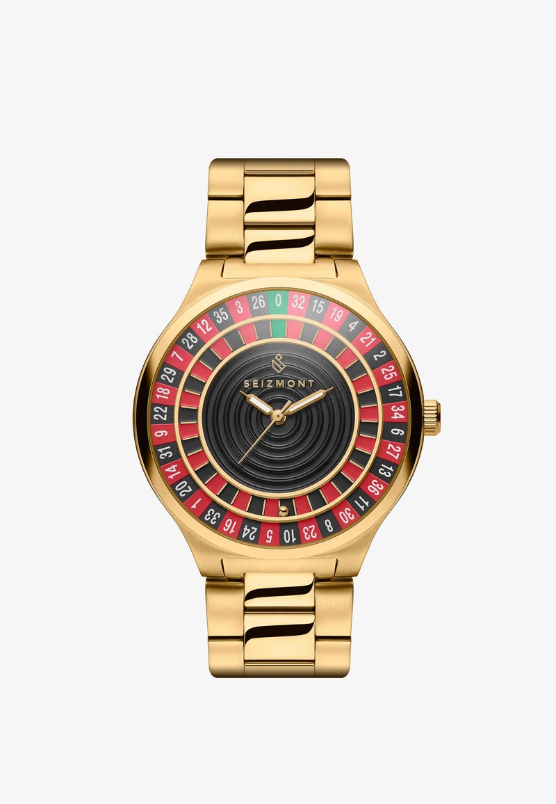 Gullfarget klokke med en svart og rød rulett-stil skive, som har runde indekser og en teksturert svart urskive, på et polert metallarmbånd.
