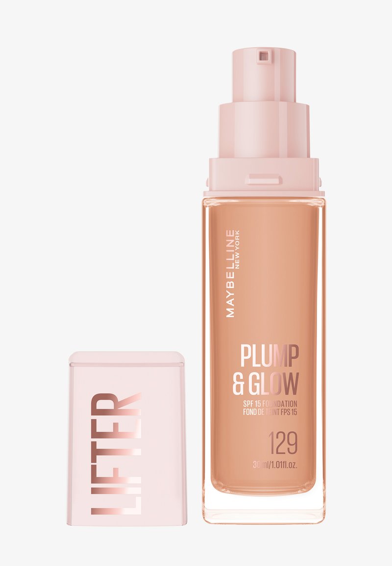 Flacon de fond de teint Maybelline Plump & Glow avec distributeur à pompe et bouchon détaché étiqueté "LIFTER", teinte 129, SPF 15, 30 ml.
