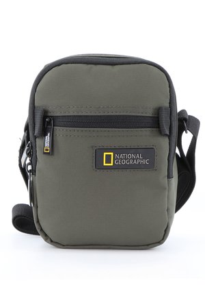 Green nylon crossbody bag featuring a front zip pocket and black accents. Displayed logo reads "National Geographic." Compact rectangular shape.