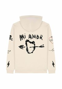 Felpa beige con cappuccio caratterizzata da grafiche nere: "Mi Amor", un cuore trafitto da una freccia, teschi, cuori e fulmini. Texture morbida, vestibilità rilassata.
