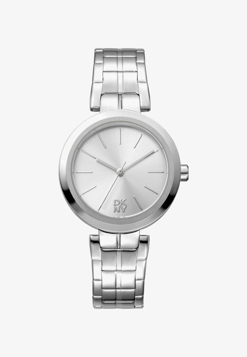 DKNY silver watch with a stainless steel strap, round bezel, minimalist dial, long hour markers, and brand logo at the bottom.