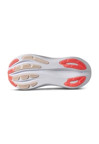 Shoe outsole in white and light beige, featuring red rubber accents and a textured grip pattern for traction, with distinct logo detail.