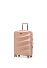 Maleta rígida color oro rosa con cuatro ruedas giratorias, asa telescópica, asa lateral y patrón texturizado de teclas de piano en el frente.