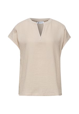 Blouse beige à manches courtes en tissu texturé, col rond avec une encoche en V et coupe décontractée.