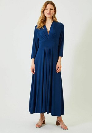 Mørkeblå, langærmet maxikjole med dyb V-udskæring, plisseret design og en tætsiddende talje, lavet af et glat, flydende materiale.
