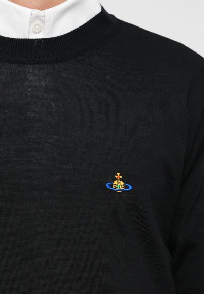 Black knit sweater featuring a round neckline and a small embroidered ship design in yellow and blue on the chest.