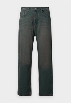 Tumedat teksased, sirge säärega disainiga, millel on ees taskud, nööbiga sulgemine ja peen kulumine siledal tekstuuril.