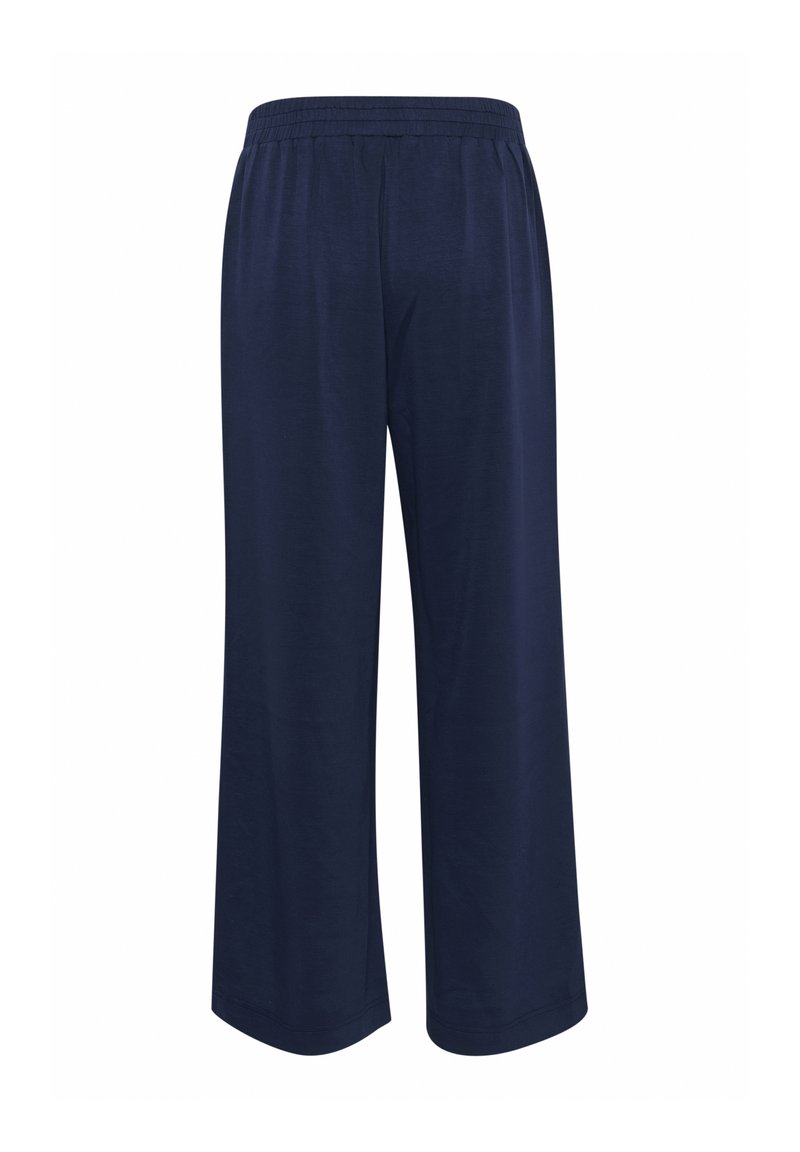 Navyblauwe wijde broek gemaakt van zachte stof. Bevat een elastische tailleband en heeft een gladde textuur zonder extra patronen of hardware.