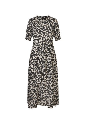 Šaty s květinovým vzorem v krémové a černé barvě. Krátké nafouklé rukávy, přiléhavý pas s páskem na zavazování a splývavá sukně sahající do poloviny lýtek.