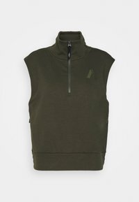 Camiseta sin mangas de color verde oscuro con cuello alto, cierre de media cremallera, dobladillo acanalado y logo en relieve en la parte delantera. Tejido suave de mezcla de algodón.