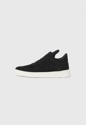 Black suede sneaker with a white rubber sole, featuring tonal stitching and lace-up design. Smooth texture with a modern, streamlined shape.