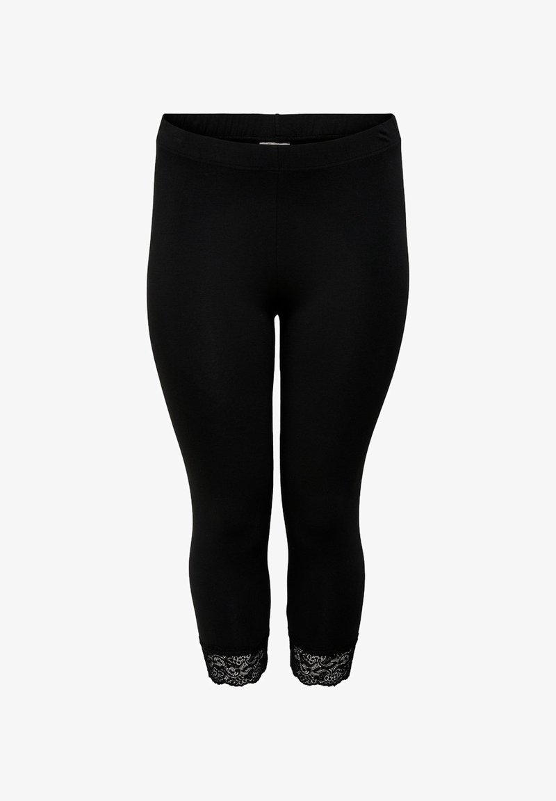 Leggings courts noirs avec taille élastique et bordure en dentelle aux ouvertures des jambes, présentés sur fond blanc.