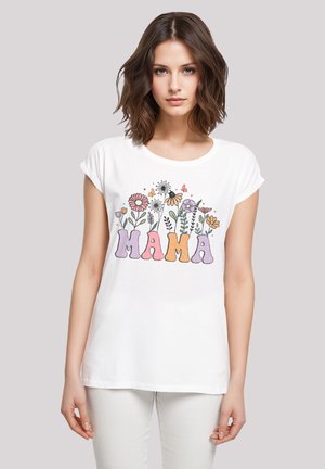 White cotton t-shirt with rolled sleeves featuring multicolored floral design and the word “MAMA” in bold letters, set against a light background.