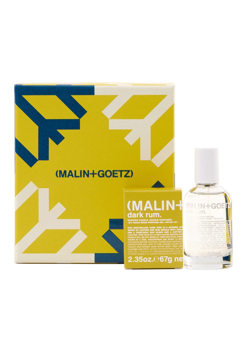 Duftkerze und Duftset in einer gelben Box mit blauen Akzenten. Enthält eine klare Glasflasche mit der Aufschrift „Dark Rum“ und eine passende Box.