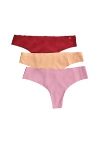 Tres pares de tangas de mujer: rojas, nude y rosas. Hechas de una tela suave con bordes en forma de ondas y un diseño minimalista.