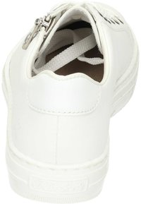 White sneaker with a textured leather upper, round toe, and a side zipper for easy access. Circular rubber sole with a subtle brand logo.