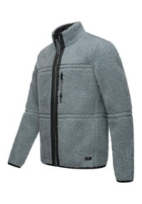 Giacca in pile di colore grigio chiaro con zip e rifiniture nere. Caratterizzata da un alto colletto e una tasca sul petto con zip; tessuto morbido e di texture.