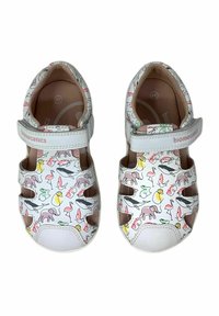 Sandali bianchi con una stampa animale colorata, cinturino regolabile, design aperto e suole in gomma. Adatti per bambini.