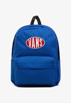 Blue canvas backpack with a red oval logo reading "VANS," featuring a front pocket and a black loop handle. Smooth texture, standard shape.