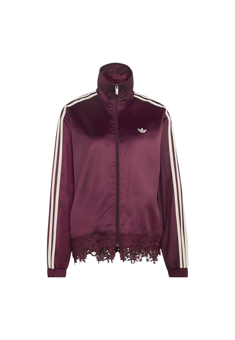 Veste zippée en satin violet avec des bandes blanches sur les manches, logo Adidas sur la poitrine et bordure en dentelle à l'ourlet.