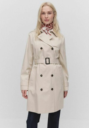 Beige trench coat with double-breasted buttons, a belt at the waist, and a classic collar. Features a smooth texture and long sleeves.