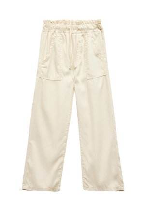 Pantalons larges beige clair en tissu doux, dotés d'une taille élastique avec cordon de serrage et de deux poches avant.