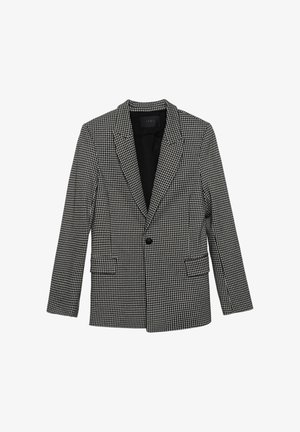 Blazer met houndstoothpatroon in zwart en wit, met lange mouwen, reverskraag, enkele knoopsluiting en twee voorkruiszakken. Gevoerde binnenkant.