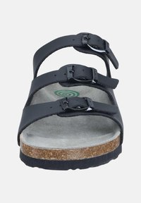 Black sandal with three adjustable straps, metal buckles, grey suede interior, and a cork footbed, featuring a textured black rubber sole.