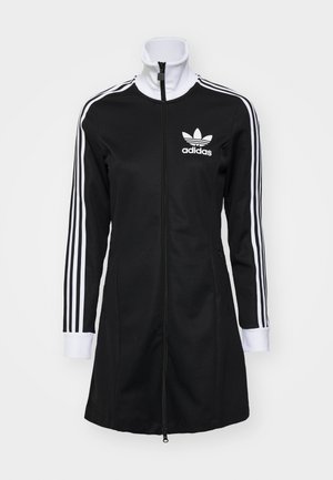 Must mustriga lukuga jope kõrge kaelusega, valge Adidas'i logo ja kolm valget triipu varrukatel. Sile tekstuuriga kude.