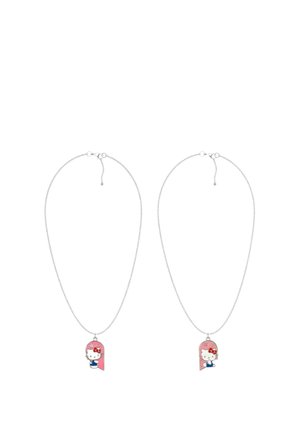 Two silver chains each with a pink pendant featuring a white cat wearing a red bow and blue outfit, shown from front and side views.