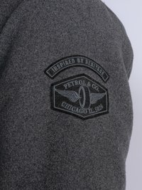 Gray felt fabric with an embroidered black patch featuring the text "Inspired by Heritage," "Petrol & Co," and "Chicago IL 5026."