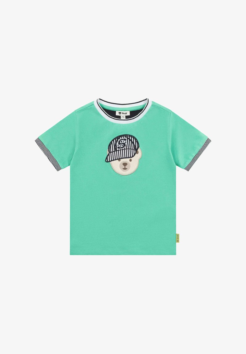 Zelené tričko s krátkým rukávem vyrobené z měkké látky. Na tričku se nachází hlava medvěda v černobíle pruhované čepici, s kontrastním límcem a okraji rukávů.