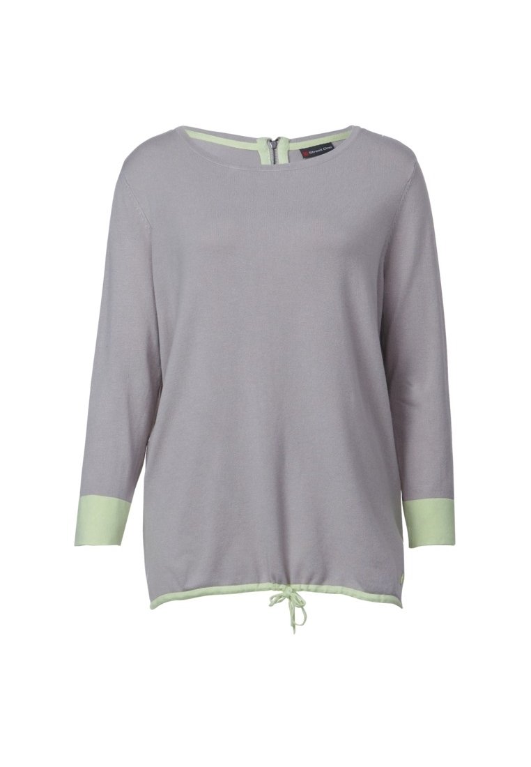 Ljusgrå topp med trekvartsärmar. Har en grön kant vid ärmsluten och fållen, samt en dragkedjestängning bak. Mjuk, strukturerad tyg med dragsko.