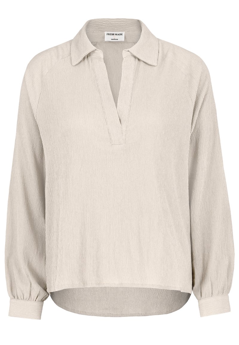 Beige Langarmshirt mit Kragen und halber Knopfleiste. Strukturierter Stoff mit gerafften Ärmeln und leicht abgerundetem Saum.