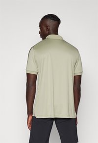 Peak Performance PLAYER - Pólóing - limit green/pine needle