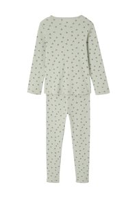 Soft green long-sleeve top and pants set with small pink and green floral print, ribbed texture, shown flat against white background.