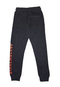 Pantaloni della tuta neri con logo stampato arancione lungo la gamba sinistra, vita elastica e tasche laterali. Realizzati in tessuto morbido e resistente.