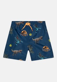 Pantaloni da bagno blu con grafiche di dinosauri e logo Jurassic World. Progettati con vita elastica e lacci arancioni.
