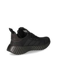 Black athletic shoe with a textured mesh upper, ribbed rubber sole, and three embossed stripes on the side. Features a pull tab at the heel.