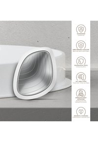 Silikone ansigtsanordning med et pæreformet spejl, der har en glat hvid overflade, tekstureret indvendig del og magnetisk opladningsport. Vandtæt (IPX7).