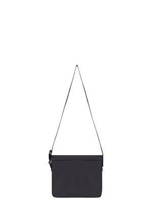 Black rectangular crossbody bag with a thin adjustable strap, front flap closure, and minimalistic design.