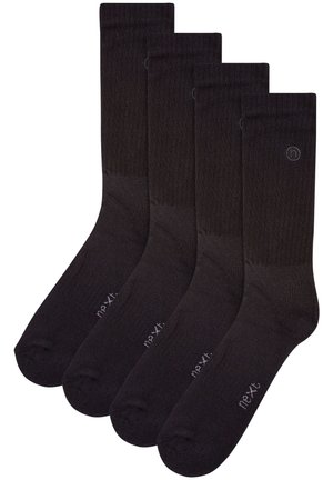 Schwarze Baumwollsocken mit geripptem Design, mit verstärkter Zehen- und Fersenpartie. Das Set enthält vier Paar, jeweils mit kleinem Markenlogo.
