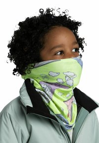 Green multifunctional scarf with cartoon-like animal graphics, soft texture, and stretchy design, worn around the neck. Light mint outer jacket.