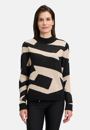Knit sweater features a black base with beige abstract patterns, crew neck, and long sleeves. Textured fabric adds visual interest.