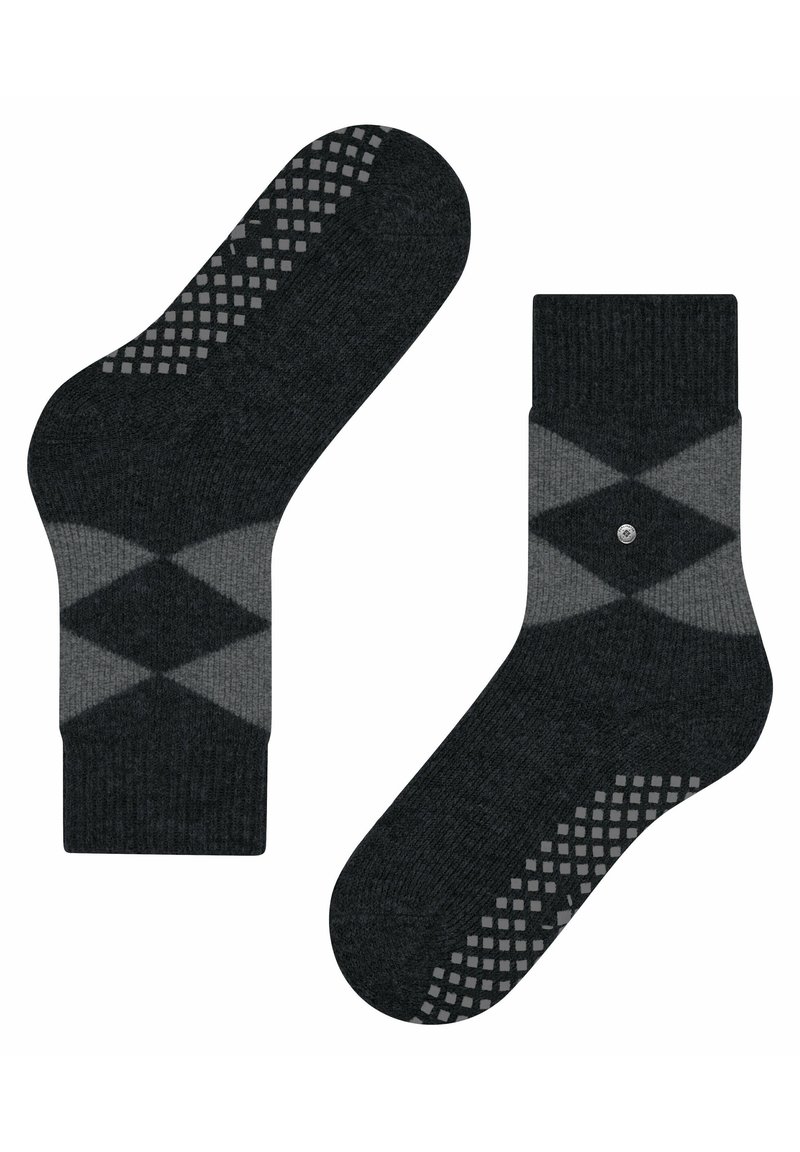 Graue Socken mit einem Argyle-Muster in dunkleren und helleren Farbtönen. Strukturierten Grip-Punkte an der Sohle. Gerippter Bund am oberen Ende.