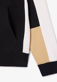 Sweat à capuche noir avec manches en blocs de couleurs blanc et beige, doté d'une poche avant et de poignets et taille côtelés.