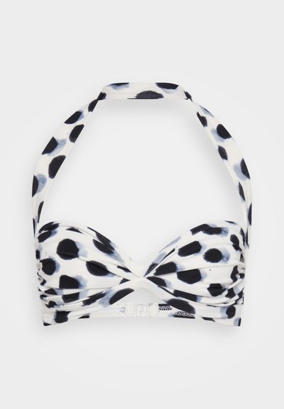 Bikini top with a twisted front design, featuring a black and white polka dot pattern, adjustable straps, and a clasp closure at the back.