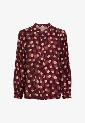 Langærmet bordeaux bluse med høj hals, prydet med et mønster af cremede prikker og frontknapper. Silkeagtig tekstur, løs pasform.